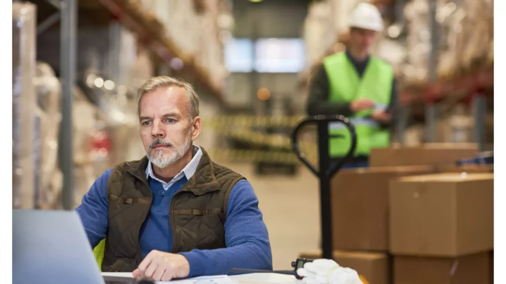 B2B distribution warehouse manager reviewing order errors caused by ecommerce connector sync delays